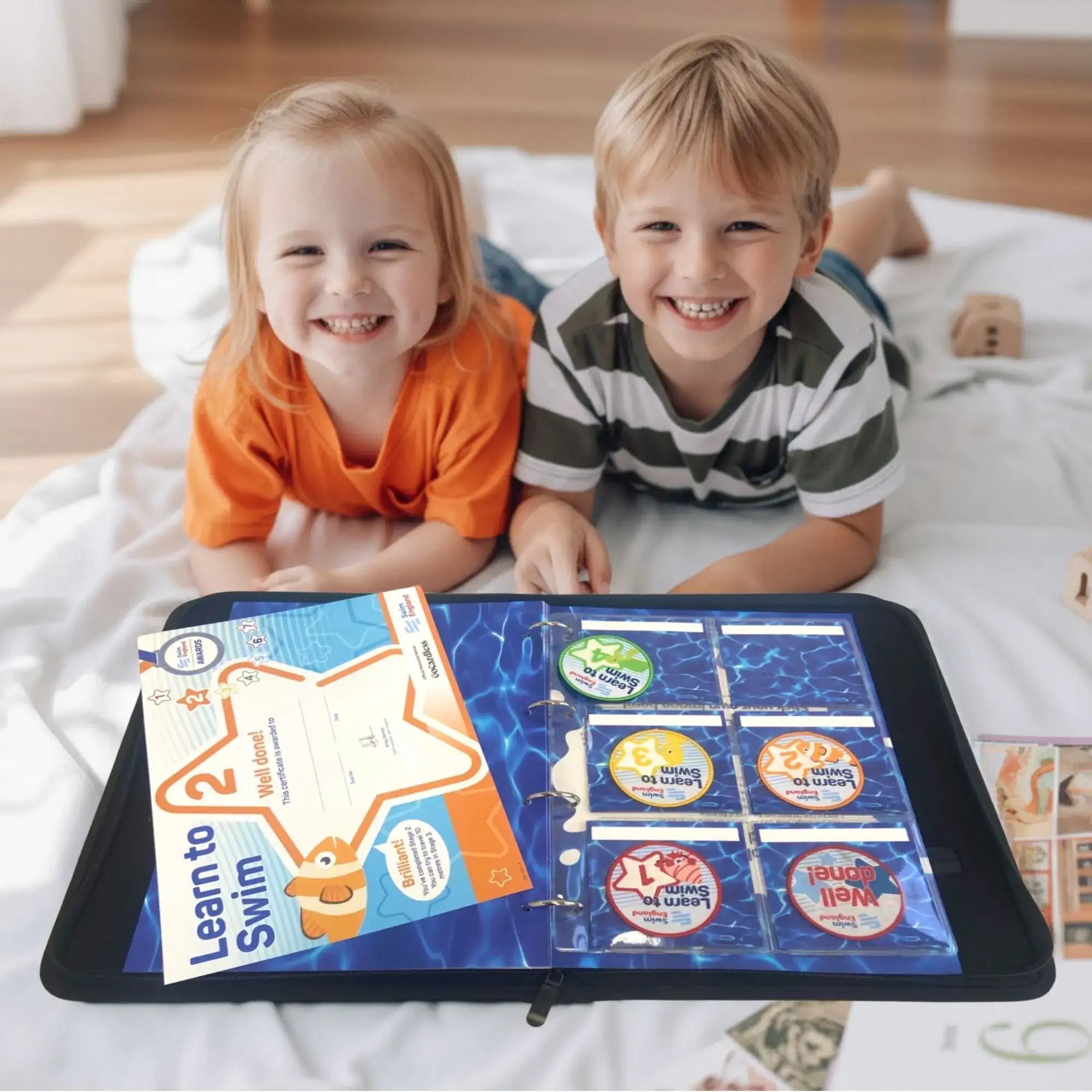 Children enjoying adding certificates and badges to their My Proud Moments Award Case